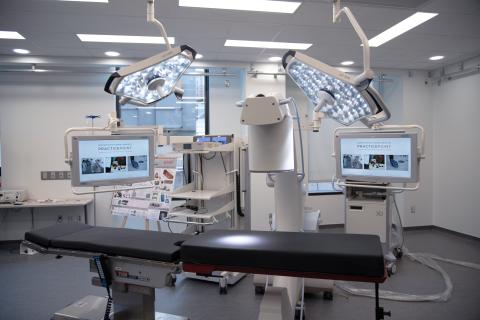 Lab equipment with multiple computer screens.