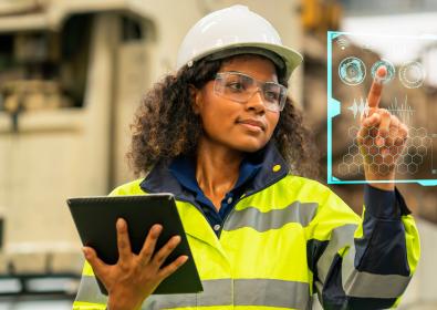 Woman hard hat reflective vest with ipad